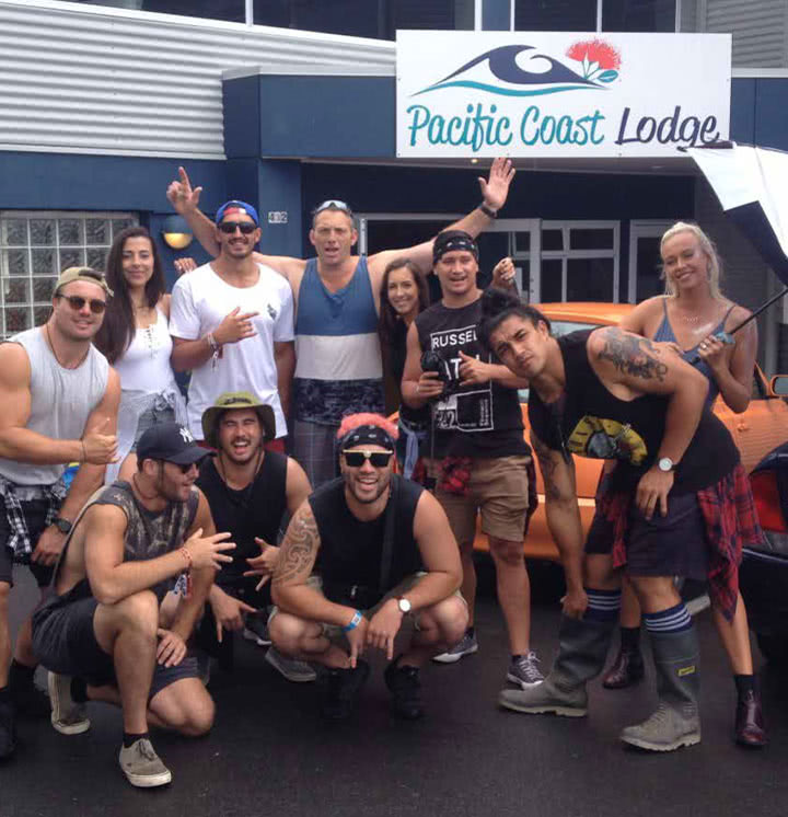 group of people posing in front of Pacific Coast Lodge