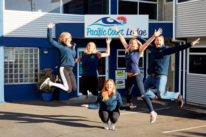 Pacific Coast Lodge staff jumping in the air